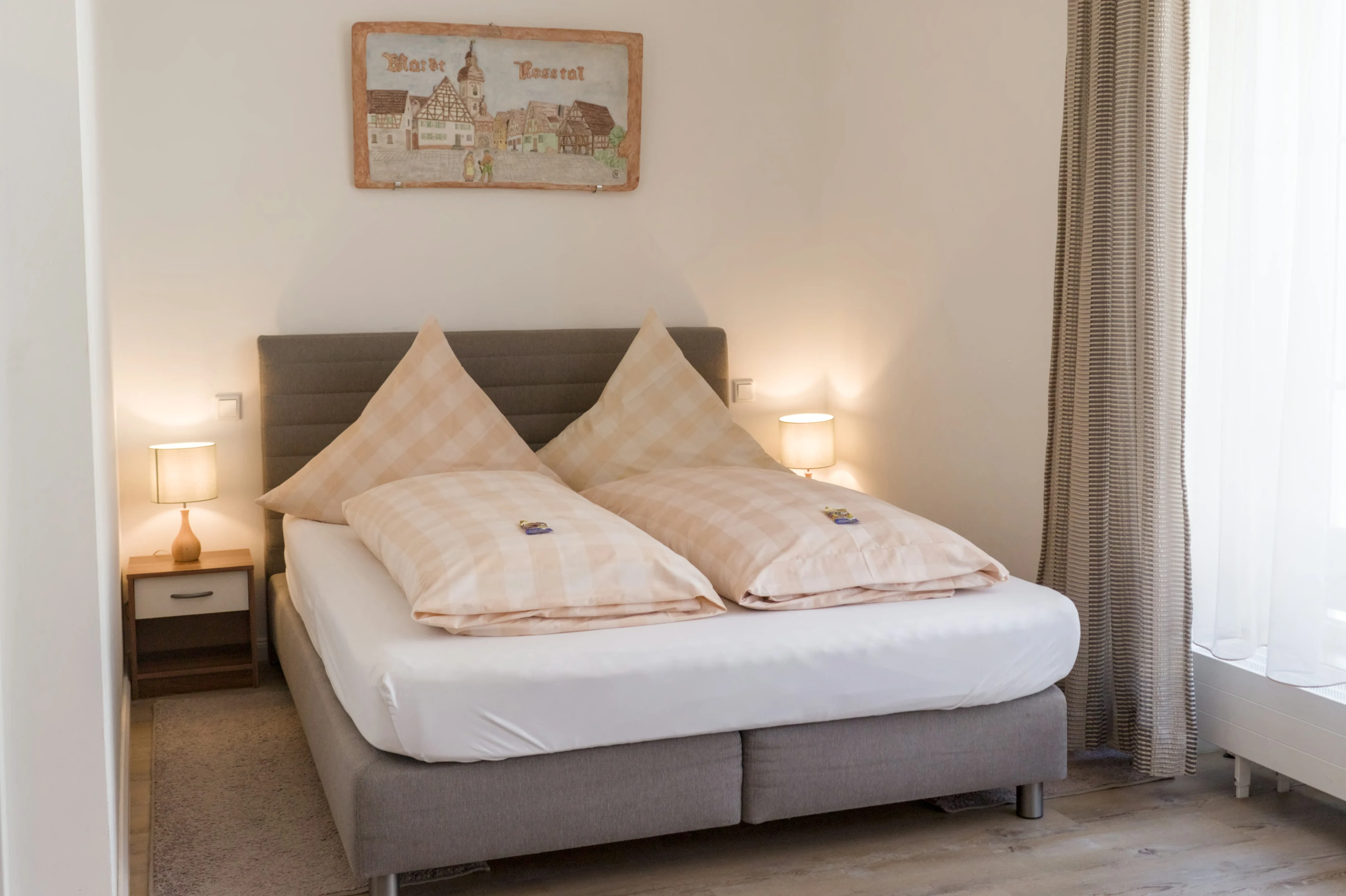 Nova apartment with a double bed and large window frontage